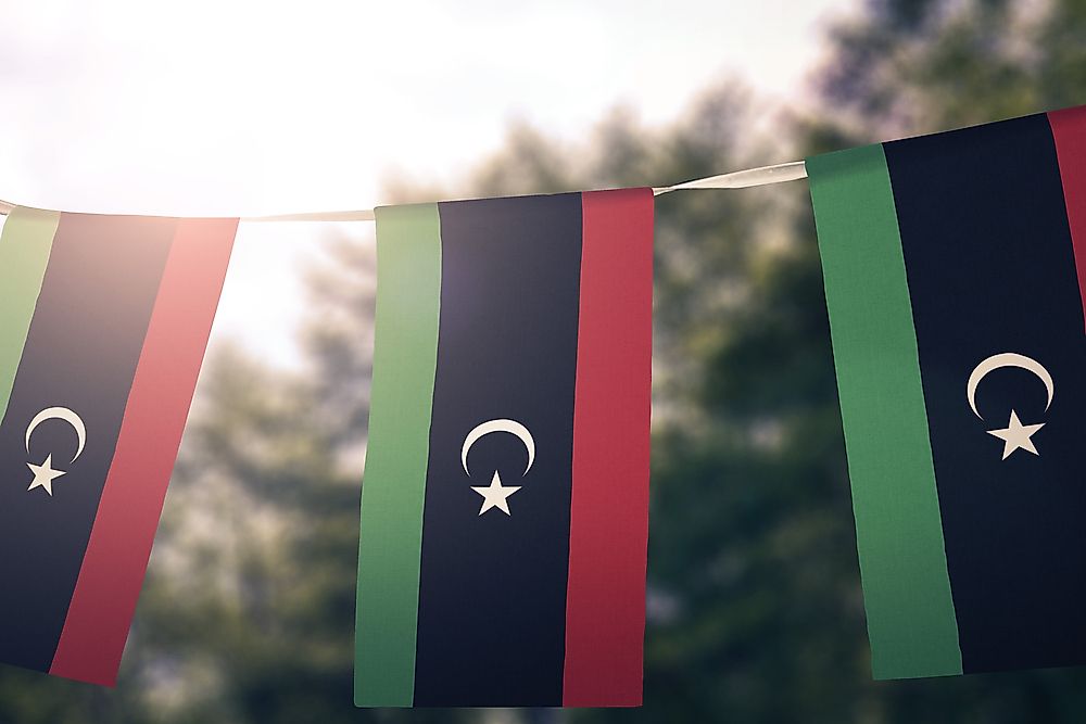 The flag of Libya on a banner.