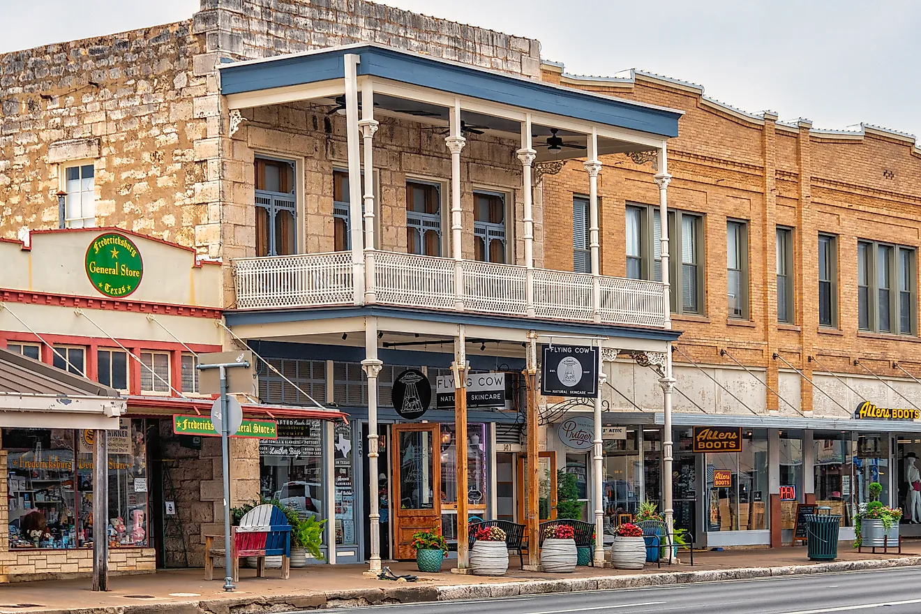 The shoppes housed in old historic buildings along Main Street through Fredericksburg, Texas, part of US 290, on a late spring morning.