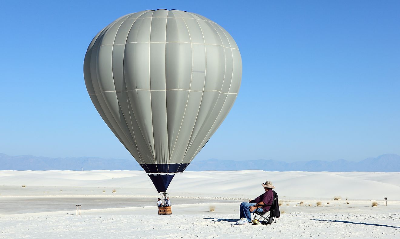 Hot air balloon and white sand dune at White Sands National Monument, New Mexico, USA