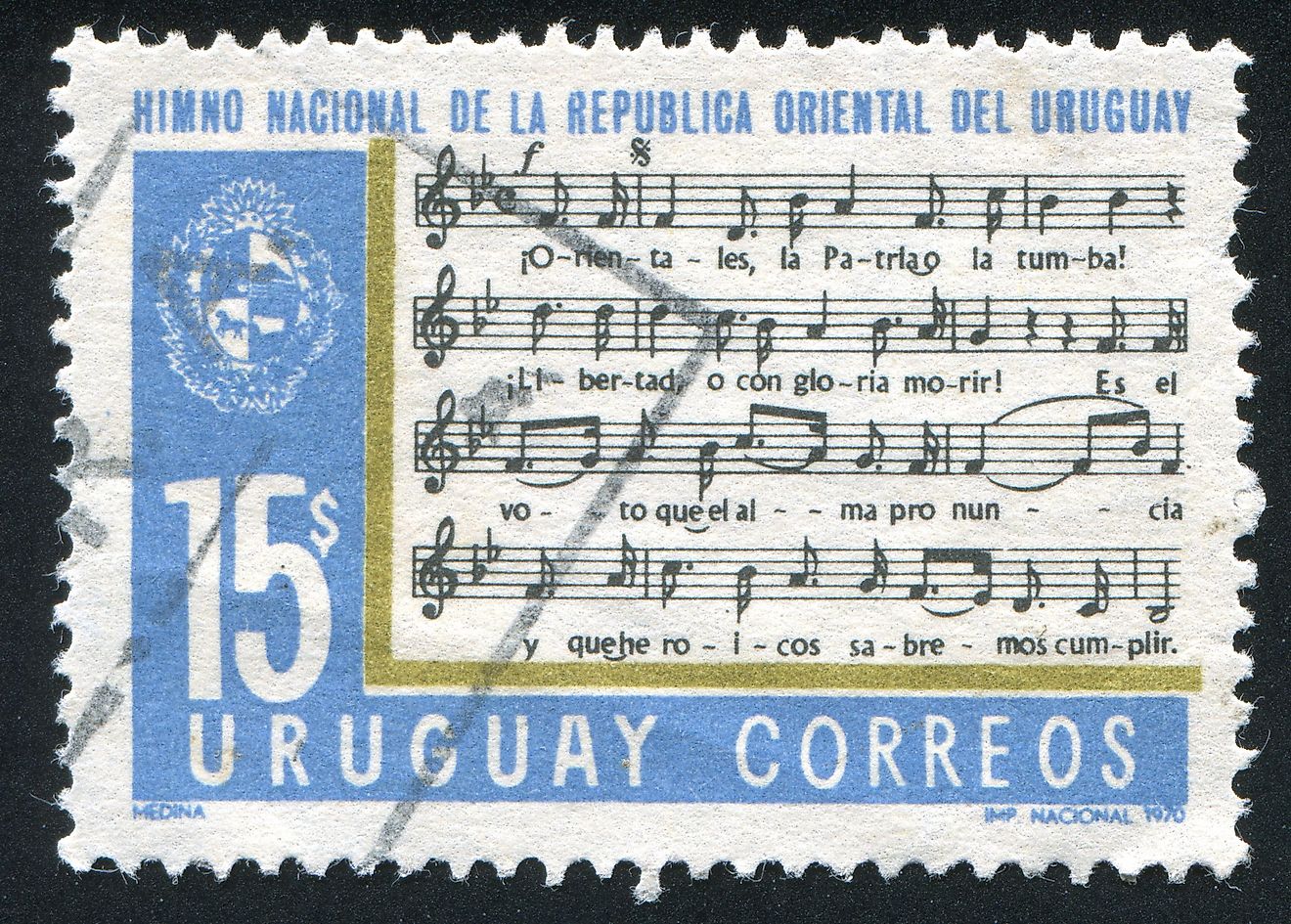 A stamp printing in Uruguay showing a section of the national anthem. Editorial credit: rook76 / Shutterstock.com.