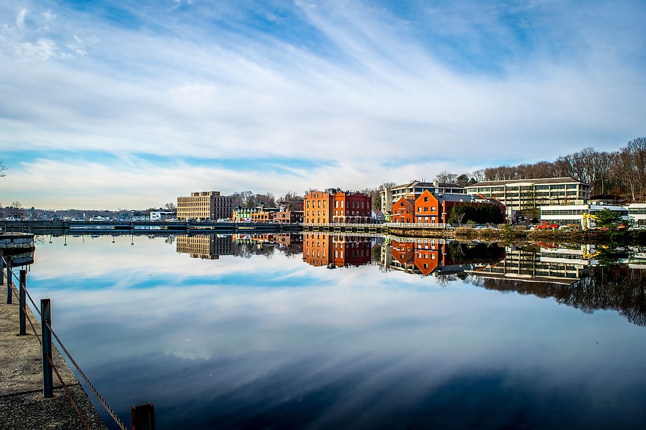 View of Westport, Connecticut, from Downtown Bridge overlooking the town and its reflection in the river. 