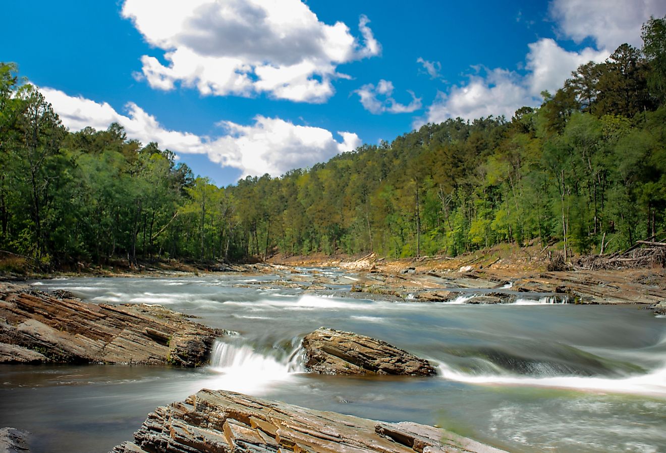 Beaver Bend State Park river view with lush forest in the background. Image credit Jordons Edits via Shutterstock.