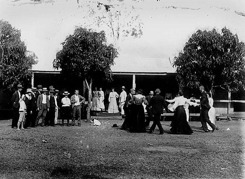 A social dance on a village commons in the early 20th Century.