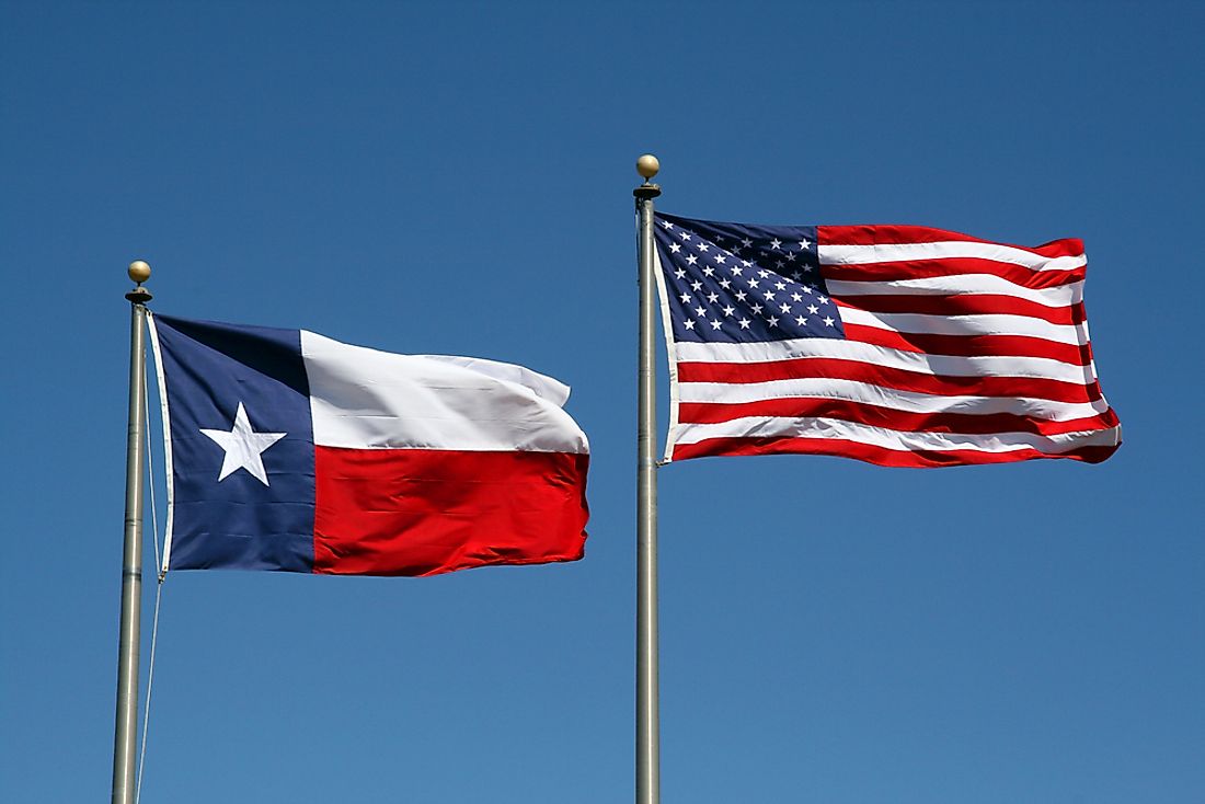 The Texas state flag (left) and United States flag (right) share the blue, red, and white colors. 