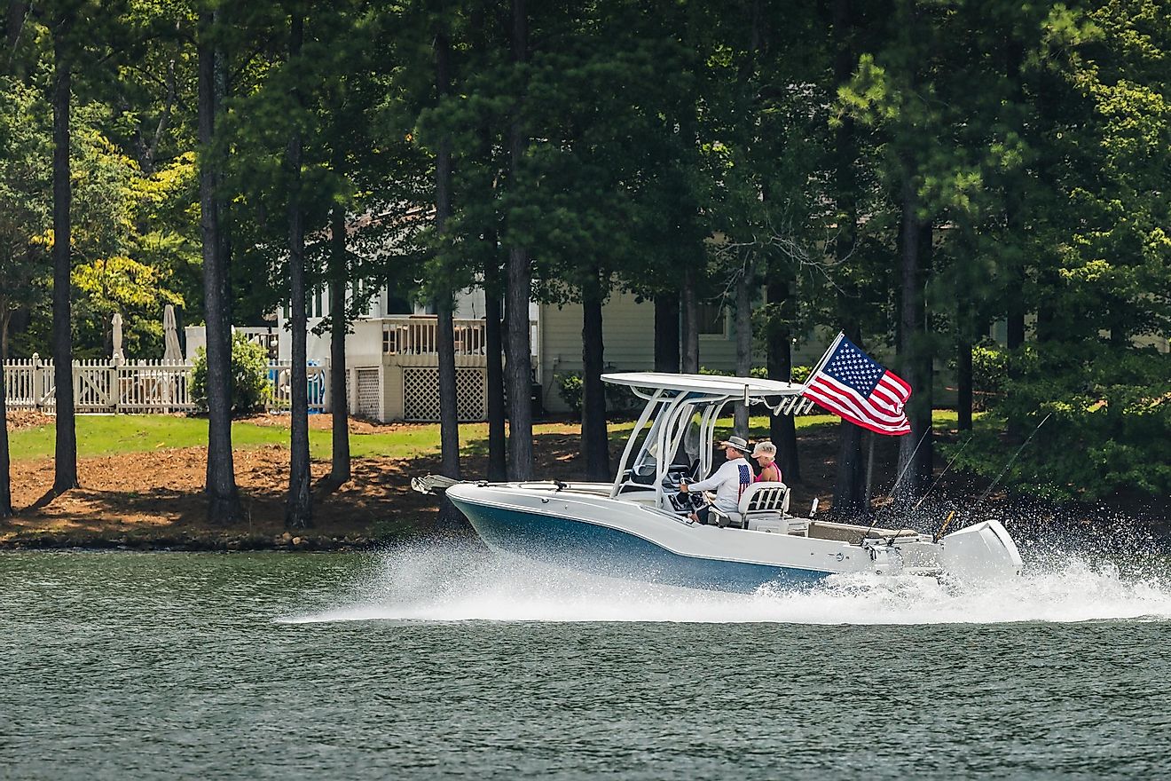 Greensboro, Georgia: Boaters on fishing boat enjoy summer day on the lake, via The Toidi / Shutterstock.com