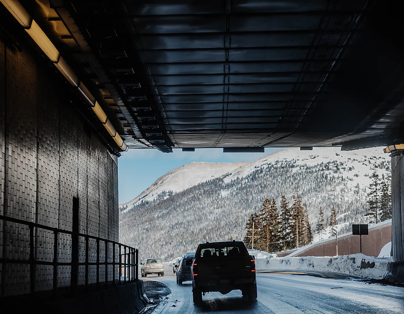 Cars traveling east bound on i70 in Colorado. Specifically traveling through the Eisenhower.