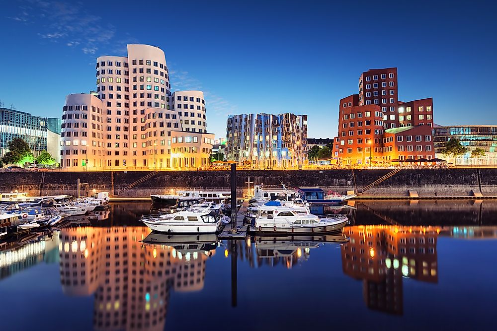 Dusseldorf, along the eastern banks of the Rhine where the Dussel river joins it, is central to the Rhine-Ruhr Metro region.