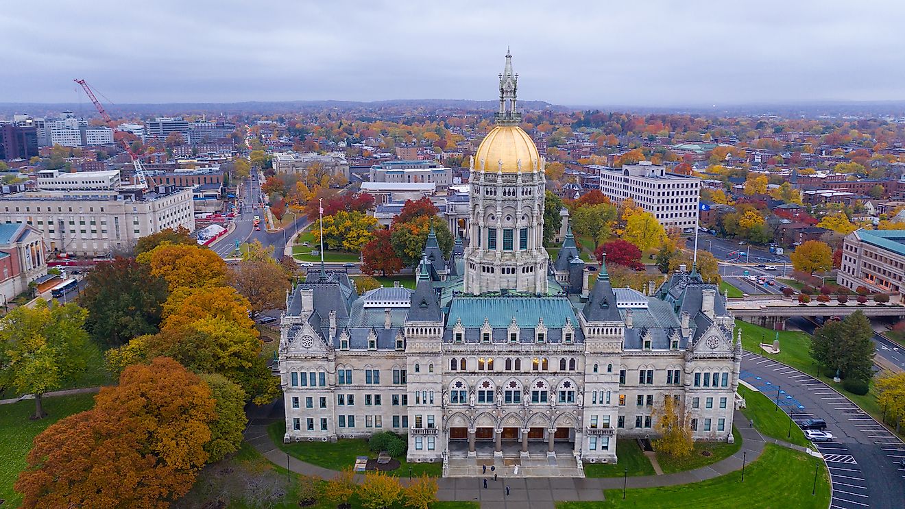 An aerial view focusing on the Connecticut State House with blazing fall color in the trees around Hartford.