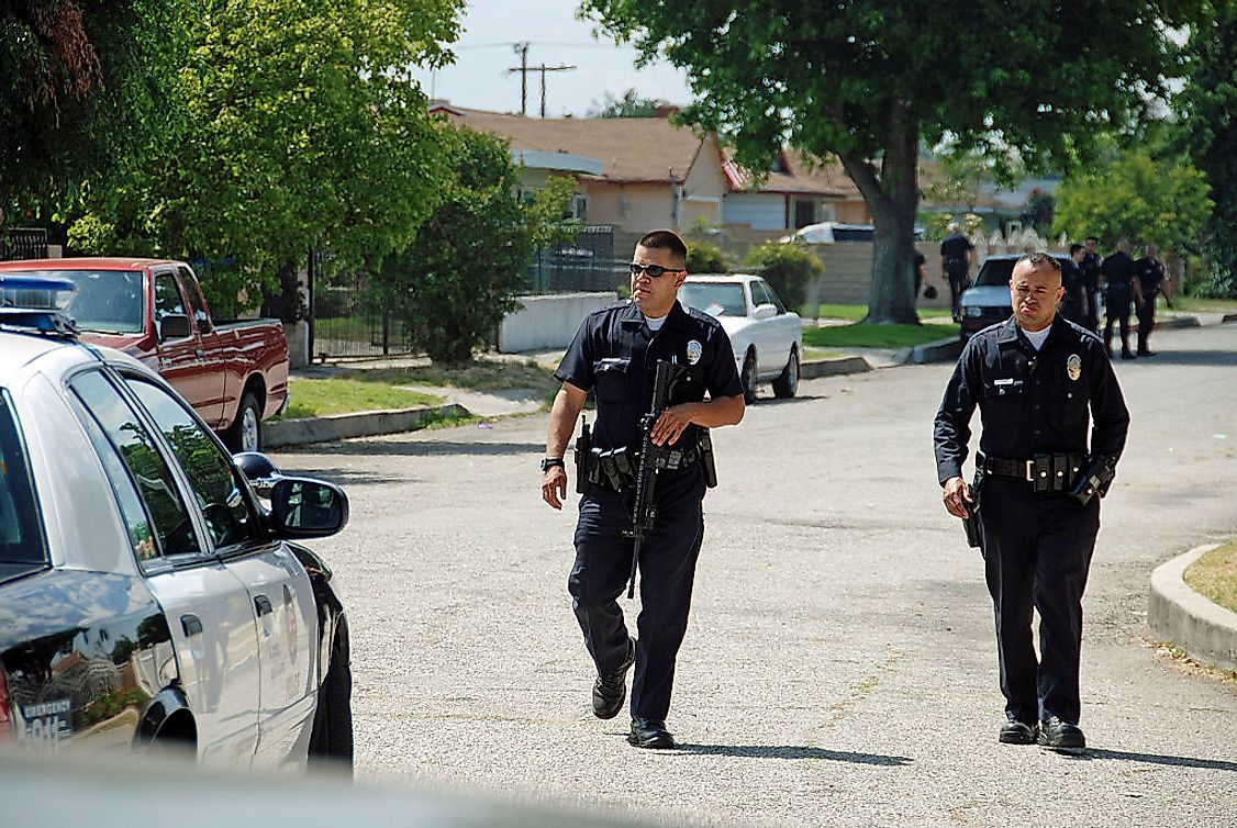 Two LAPD officer walking to a patrol car in Mission Hills