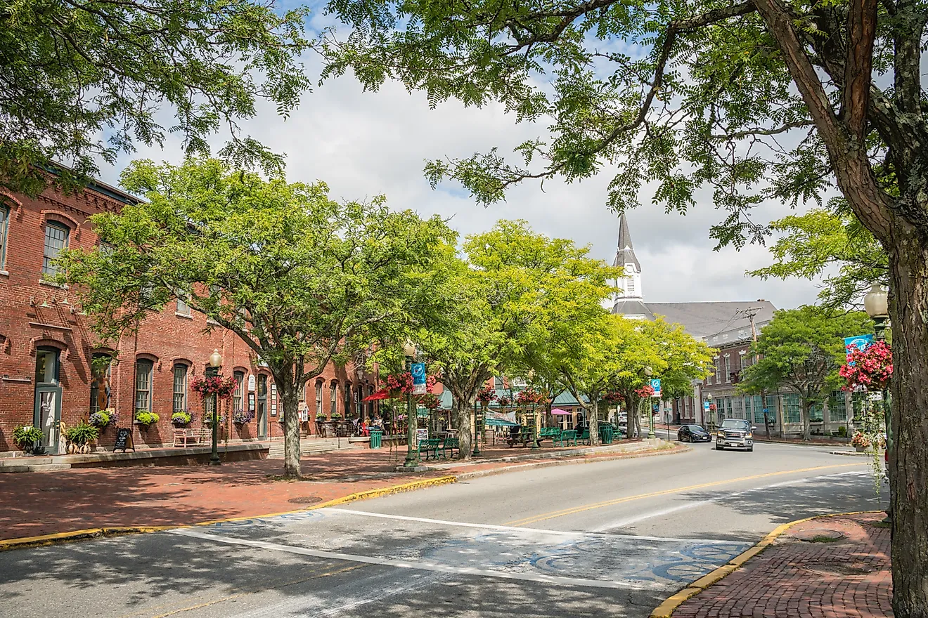 Downtown with historic brick mill buildings and trendy restaurants and charming shops in Amesbury, Massachusetts. Image credit Heidi Besen via Shutterstock
