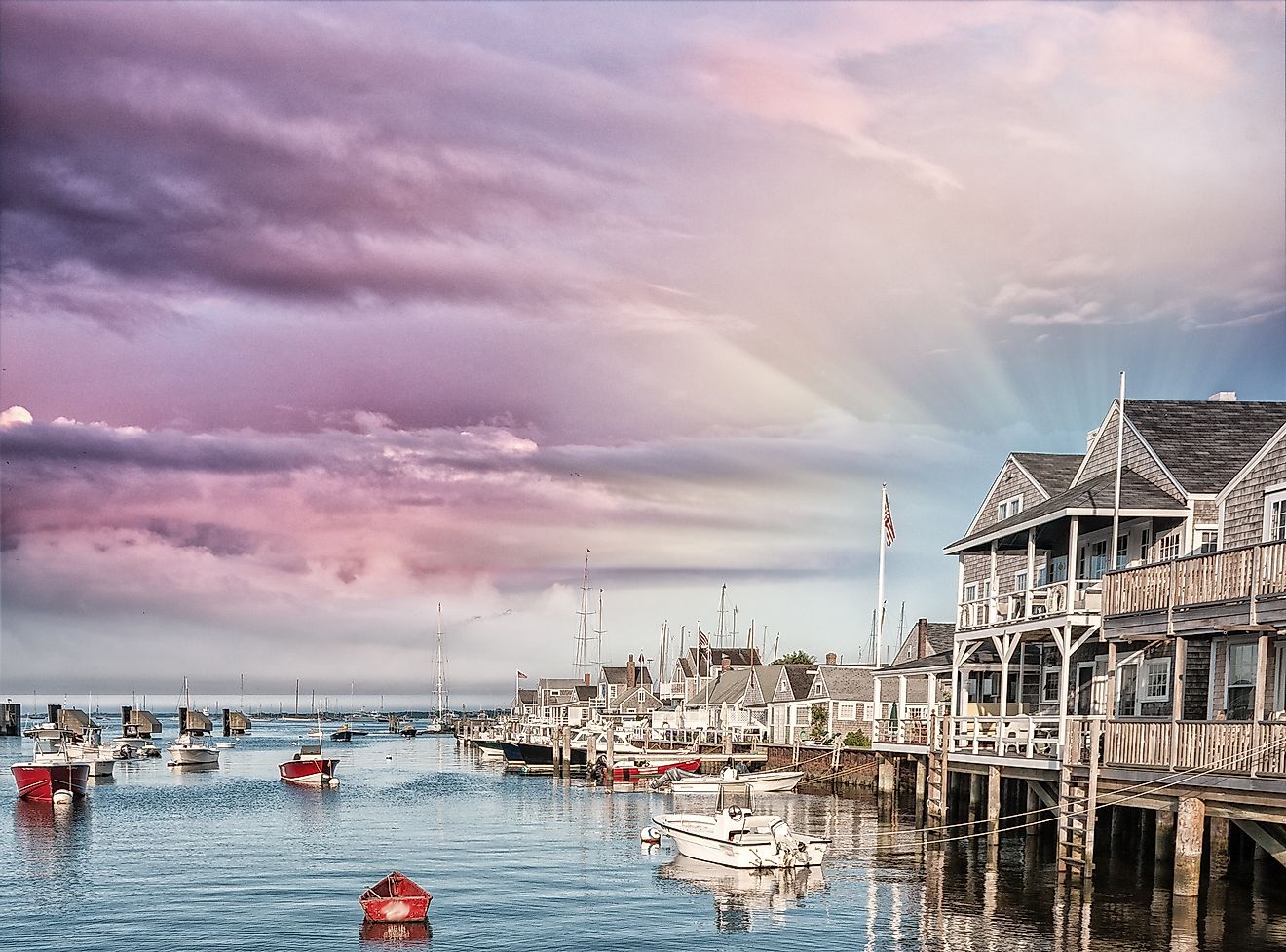 Beautiful homes of Nantucket, Massachusetts, USA. Houses over water at dusk.