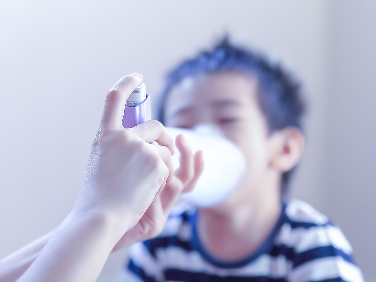 A child suffering from an asthma attack receiving treatment. Image credit: Goldenjack/Shutterstock.com