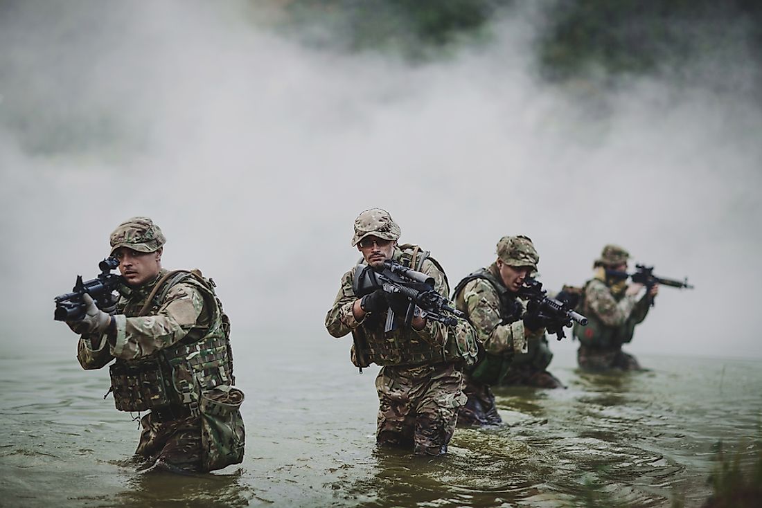 British special forces soldiers with weapon take part in military maneuver.