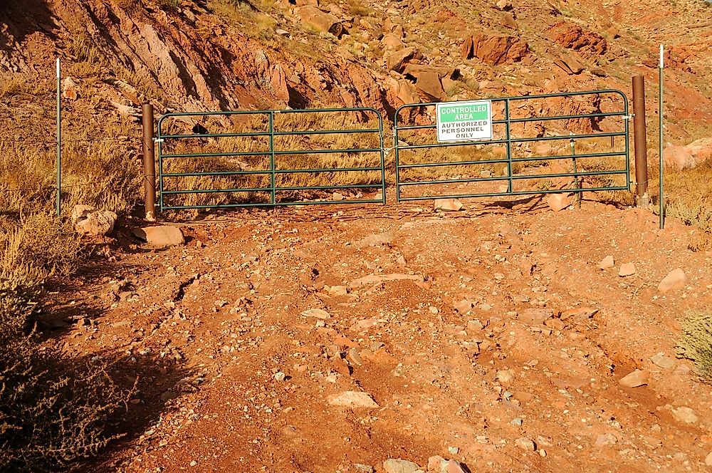 A sign denoting a contaminated area that is part of a Superfund site.