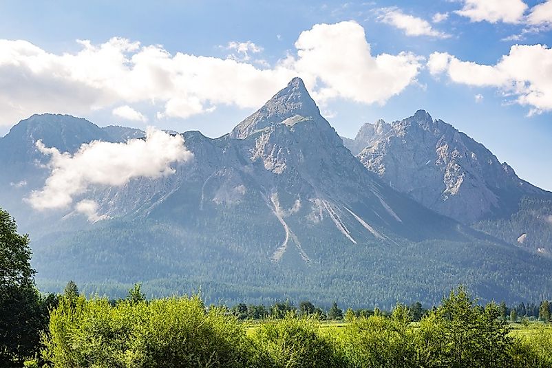 Zugspitze along the Austrian border overshadows the Bavarian landscapes below it.