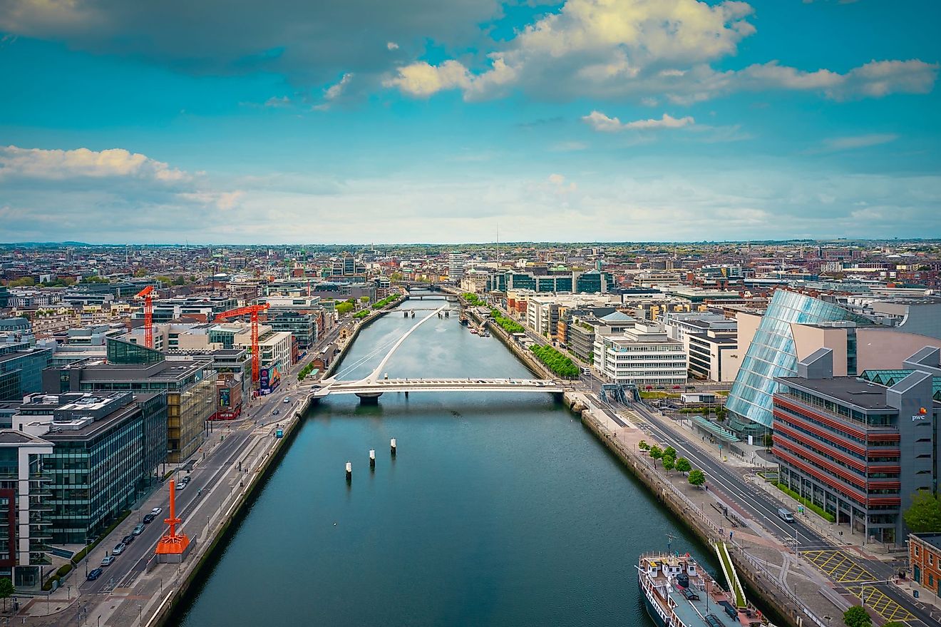 Aerial view of the Dublin city center at sunset with River Liffey and Samuel Beckett Bridge. Editorial credit: 4H4 Photography / Shutterstock.com