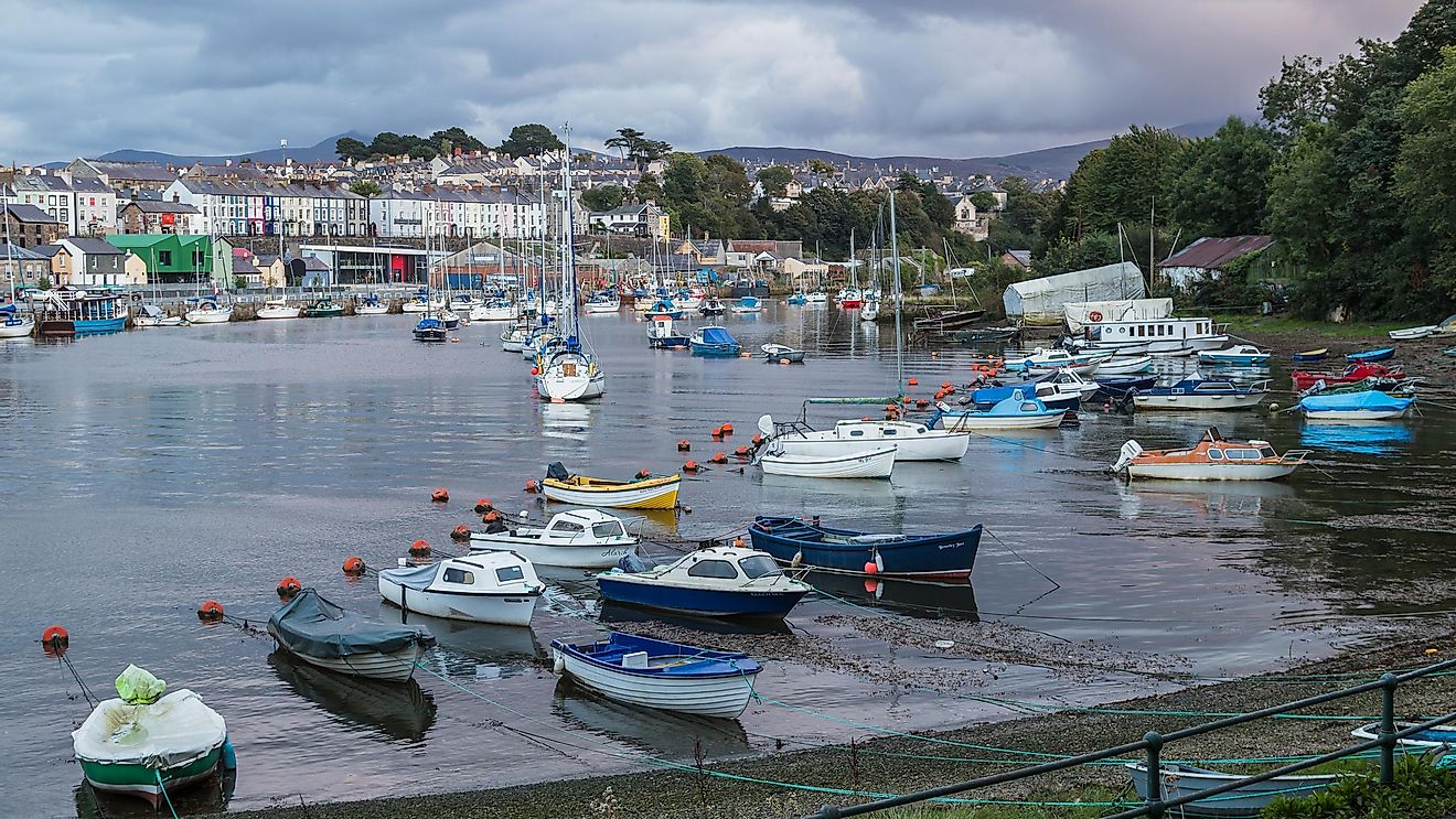 Boats lined up in Caernarfon Harbour on the North Wales coastline. Editorial credit: Jason Wells / Shutterstock.com