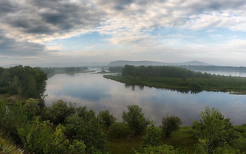 The Yenisei River in the forest on a quiet summer morning.