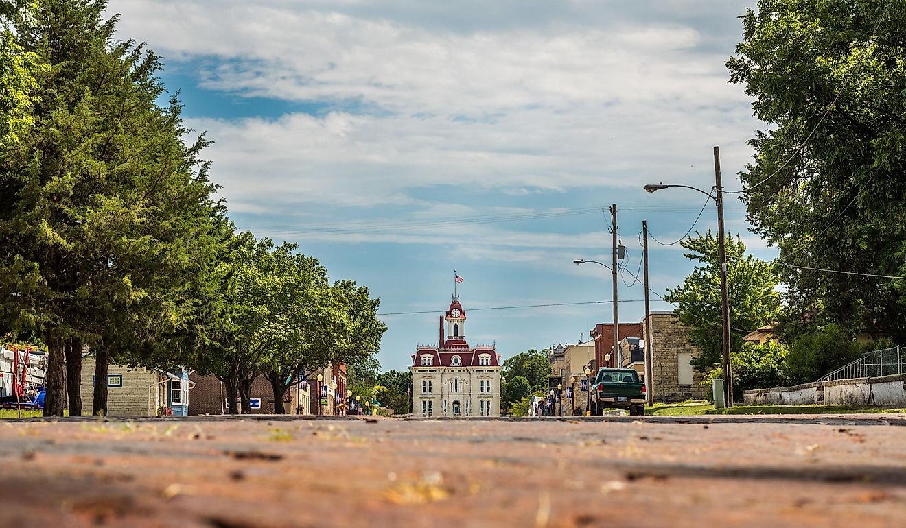 Horizontal photo of the old downtown area of Cottonwood Falls, KS with the courthouse at the end of the street.