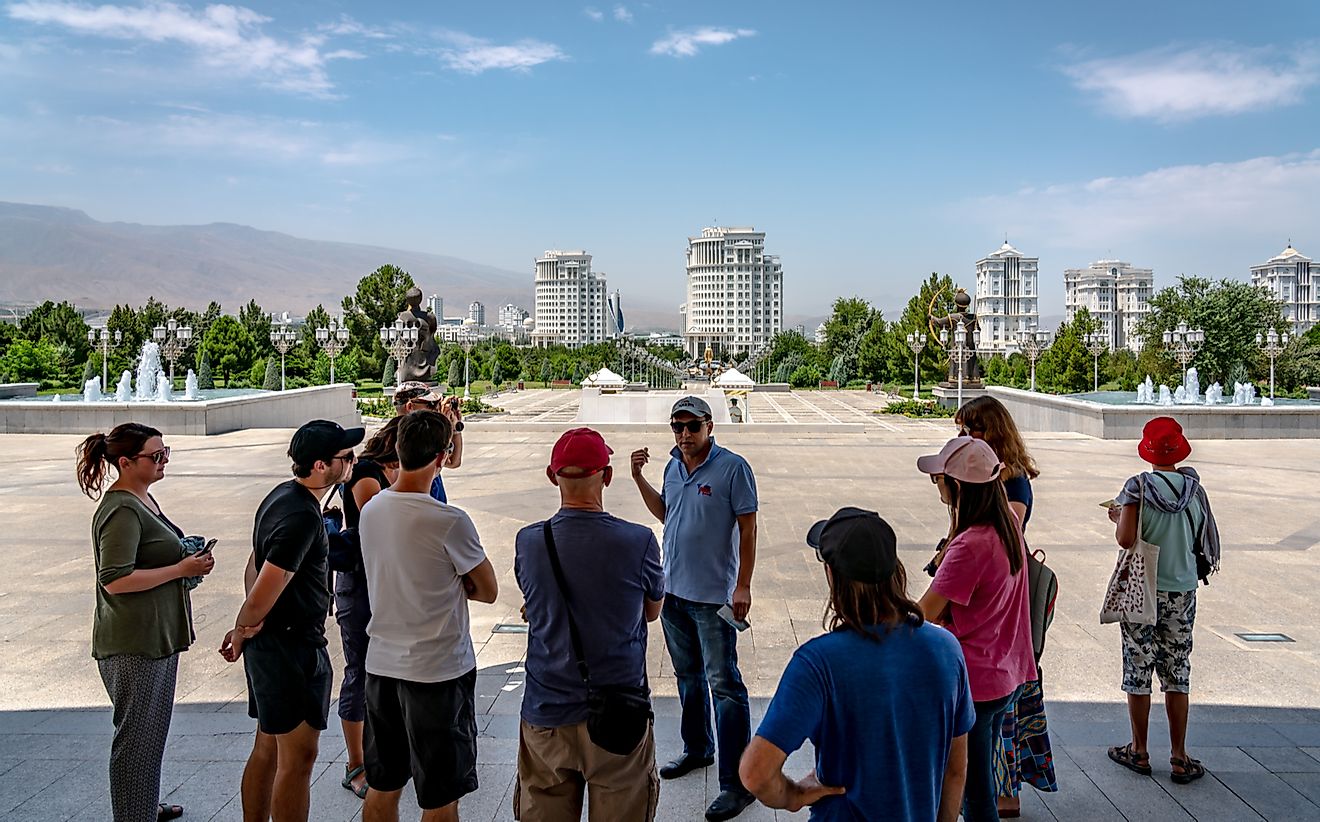 A group of tourists go on a spacious sightseeing adventure around Ashgabat. LMspencer / Shutterstock.com.