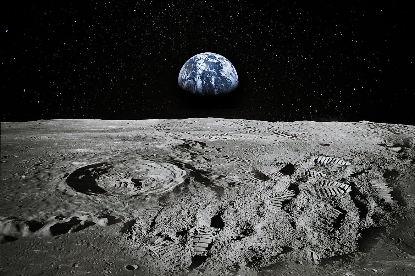 View of Moon surface with Earth rising on the horizon. 