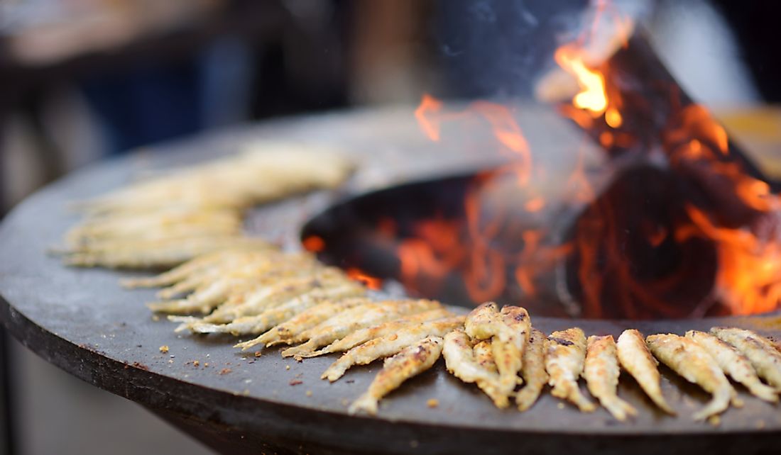 Fried fish being cooked at a market in Vilnius, Lithuania.