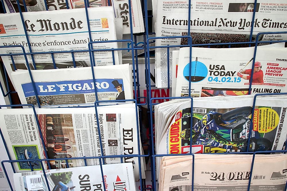 A newsstand in New York showing a variety of languages. Editorial credit: Thinglass / Shutterstock.com. 