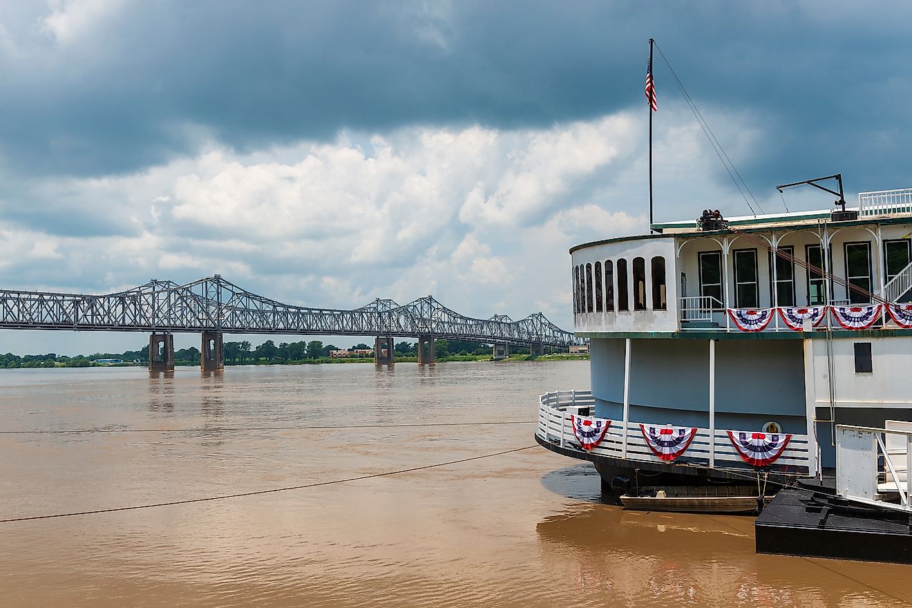 Detail of a steamer boat and the bridge over the Mississippi River near the city of Natchez, Mississippi.