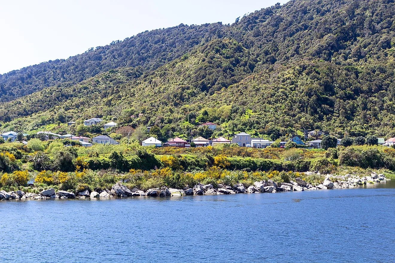 Charming houses sit near the Grey River in Greymouth, New Zealand.