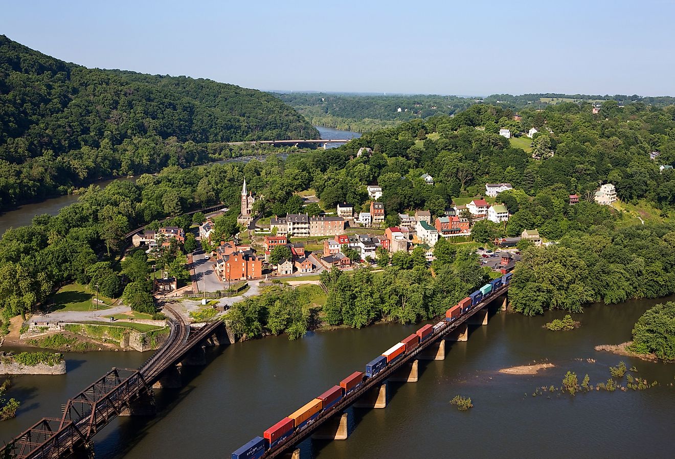 A train rolls across the Shenandoah River in an aerial view of the town of Harpers Ferry, West Virginia.