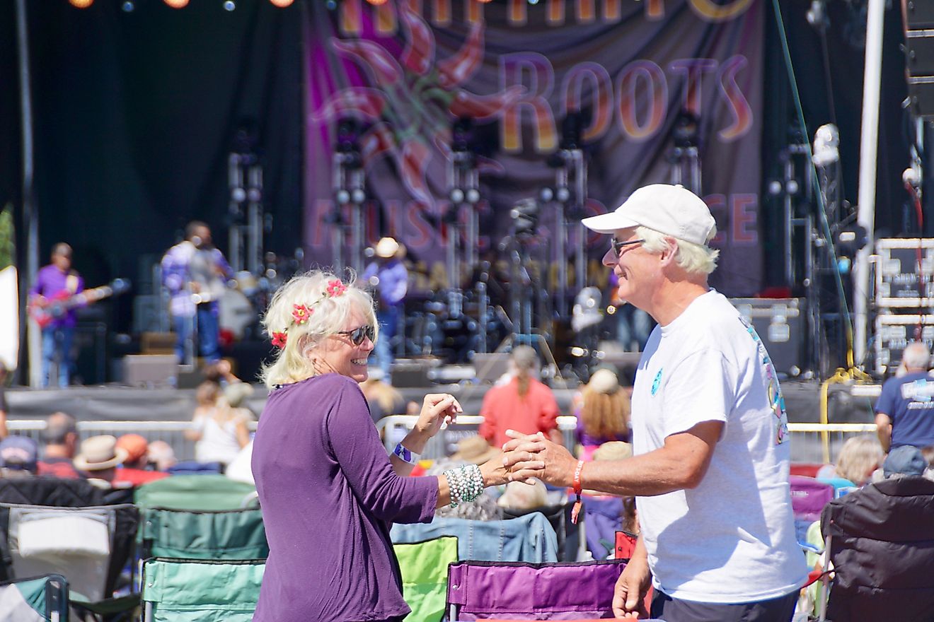 Seniors dancing at an outdoor music festival in Charlestown, Rhode Island. Image credit Carol Ann Mossa via Shutterstock