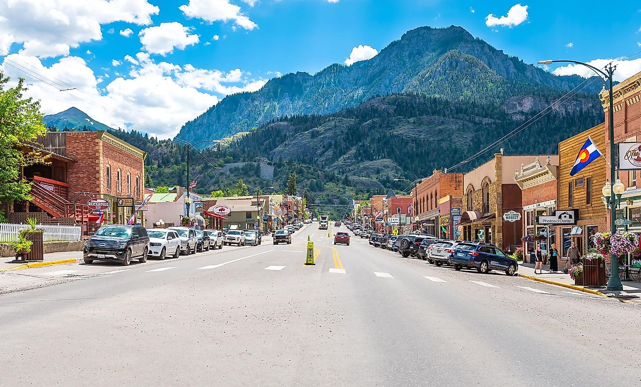 Ouray, USA: Small town ski resort mountain village city in Colorado, main street and San Juan mountains, store shops and restaurants