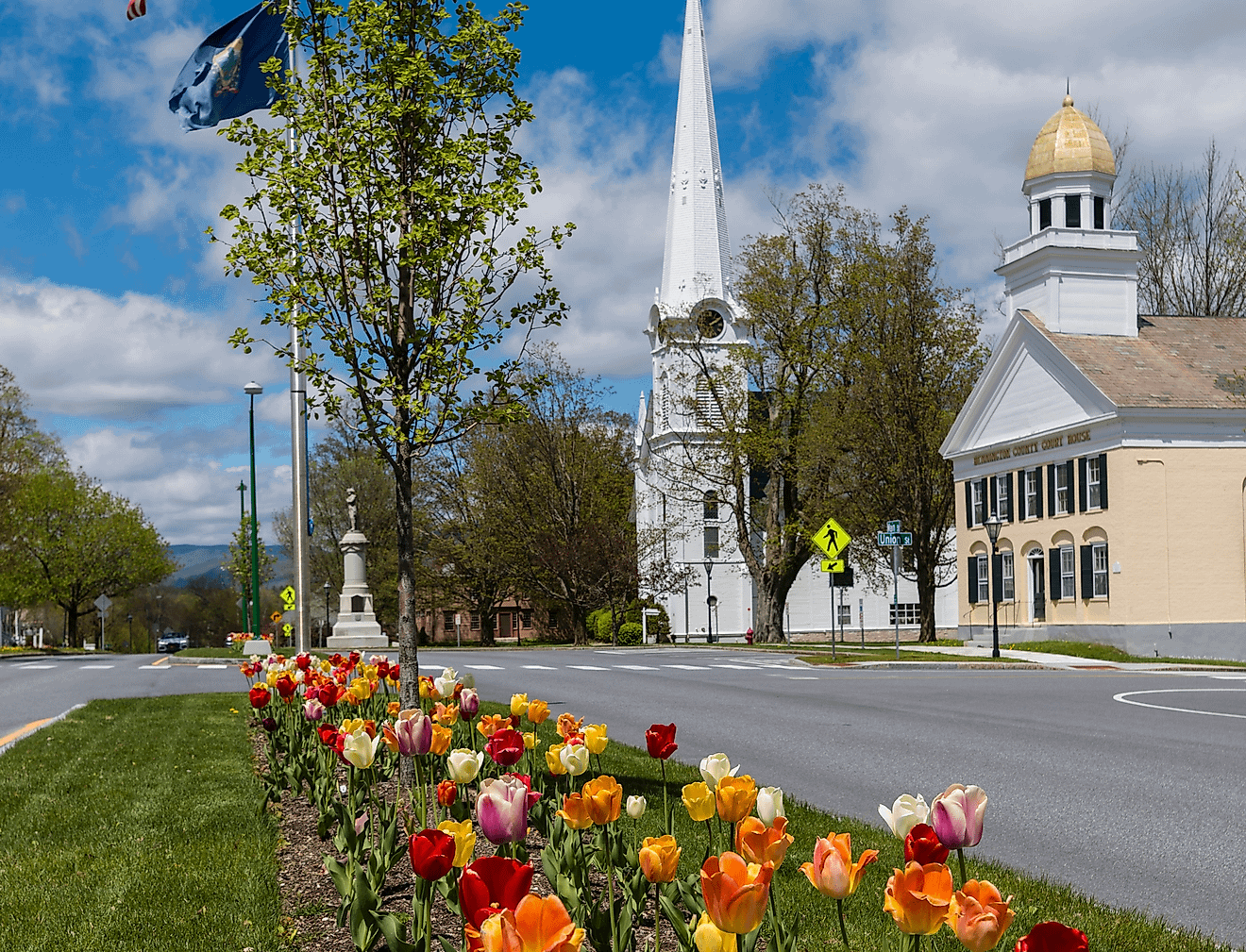 View of the historic and colorful Manchester Village in Manchester, Vermont with tulips in bloom