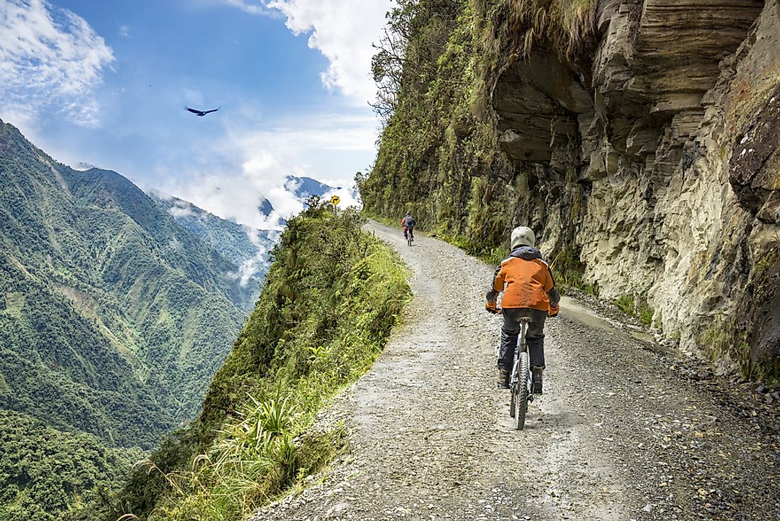 Tourists bicycle through the mountains of Bolivia. 
