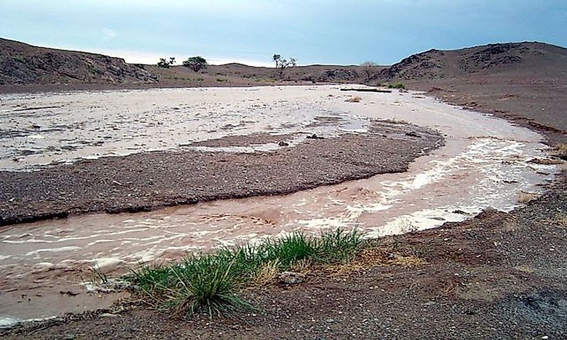 A flash flood hits a dry streambed in the Gobi Desert.
