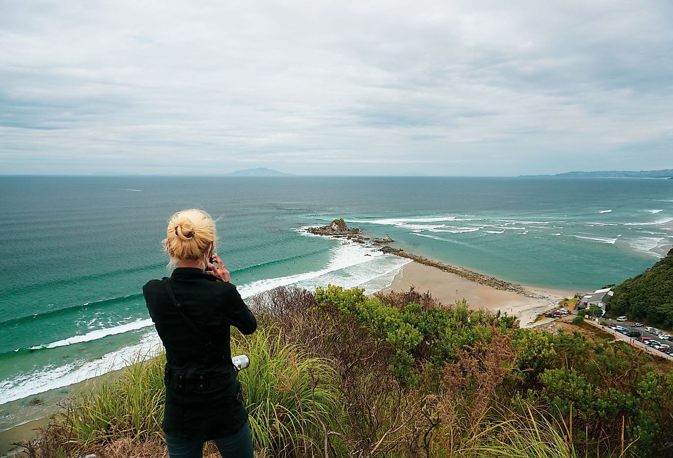 Tourists and local people visit Mangawhai Head Beach in the Northland region, New Zealand. Editorial credit: Handoko Kurniawan / Shutterstock.com