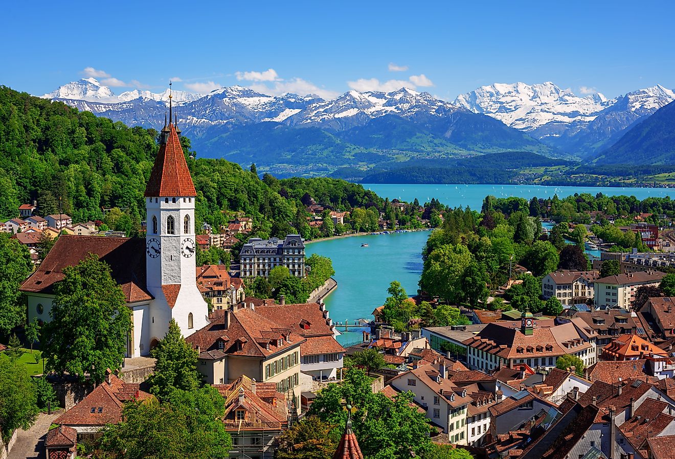 Historical Thun city and Lake Thun with snow covered Bernese Highlands Swiss Alps mountains in background, Canton Bern, Switzerland.