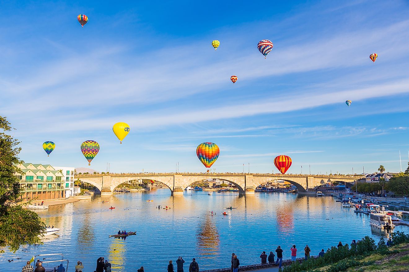 Hot air balloons flying above London Bridge in Lake Havasu.