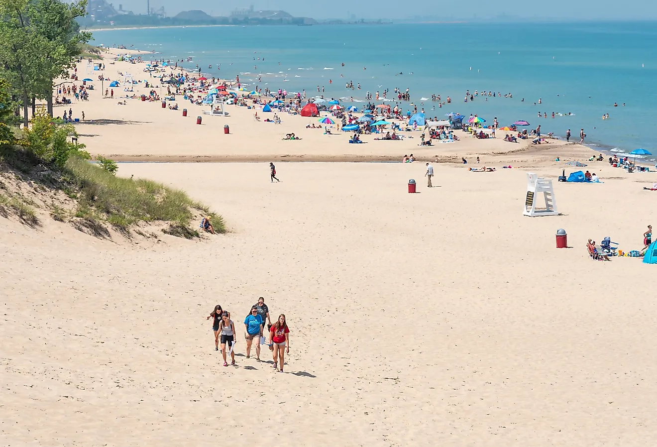 Beach scene on a sunny day at Indiana Dunes State Beach, Lake Michigan. Image credit HPK Images via Shutterstock