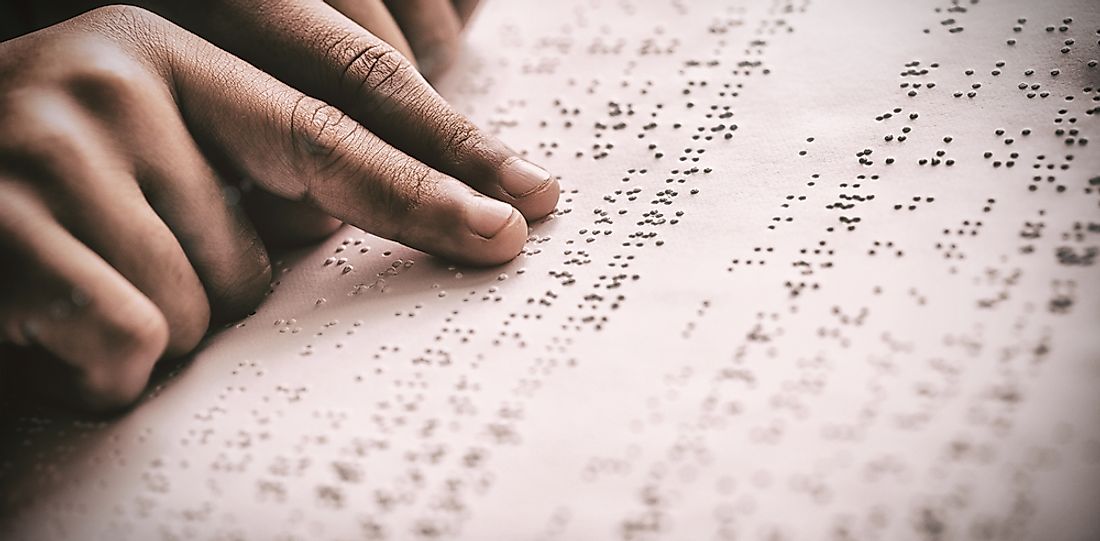 Braille is a tactile system of raised dots felt with the reader's finger. 