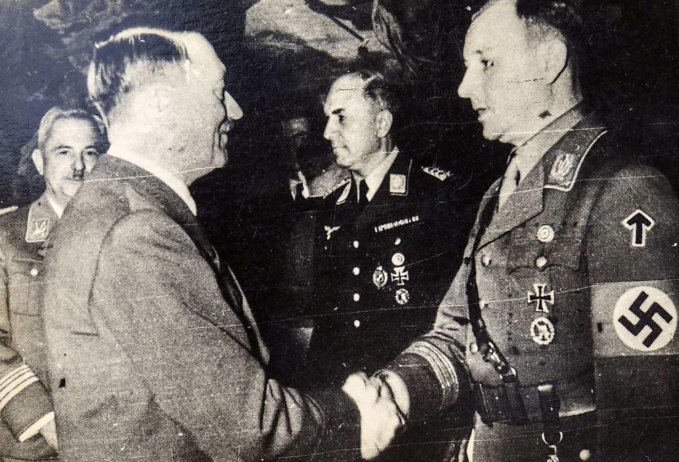 Adolf Hitler shakes hands with Victor Lutz, Chief of Staff of the SA after murder of Ernst Rohm. Image credit IgorGolovniov via Shutterstock