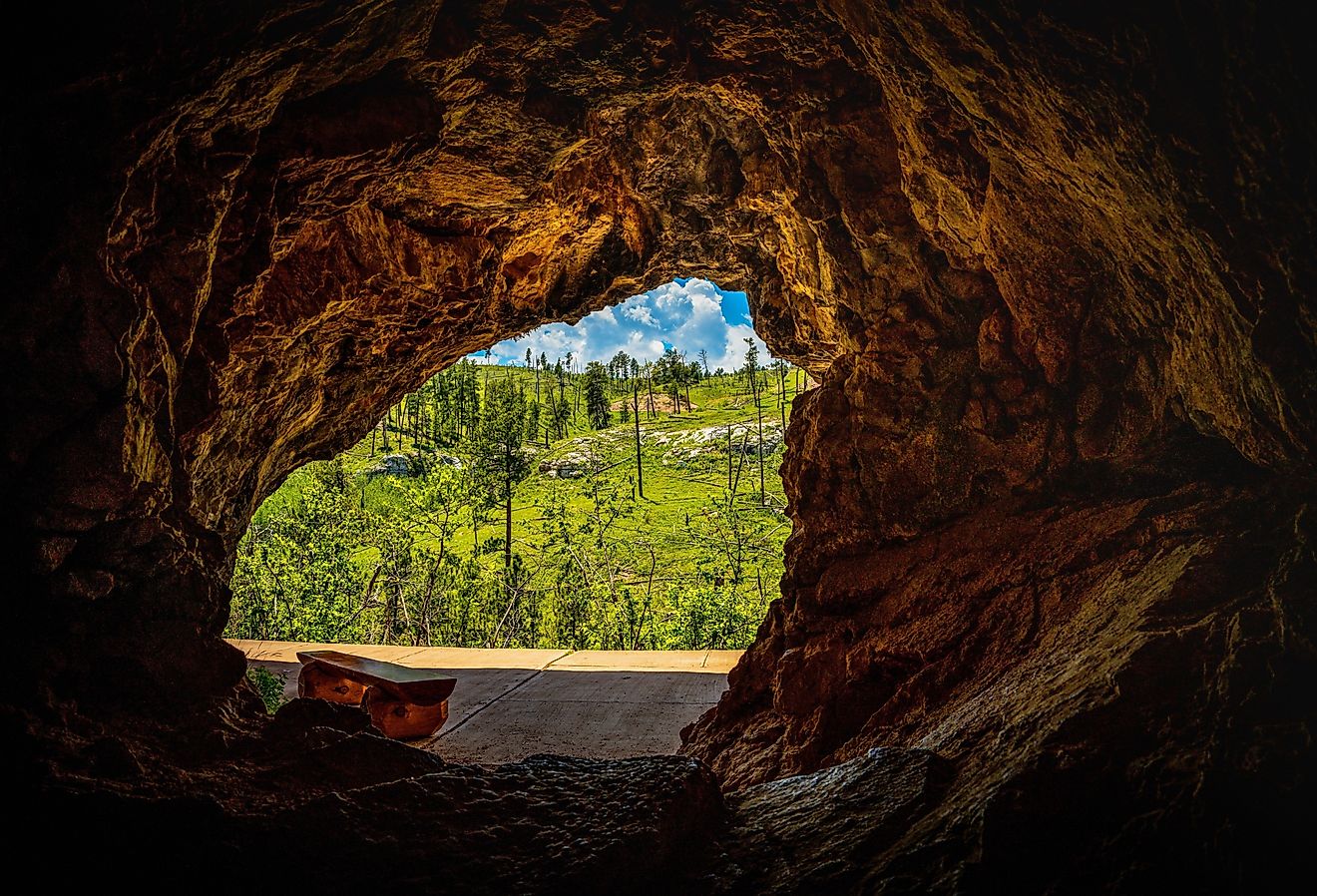 Jewel Cave National Monument Historic Site with outside hill view: The beautiful rock formation and opening at Custer State Park, Black Hills Country, South Dakota