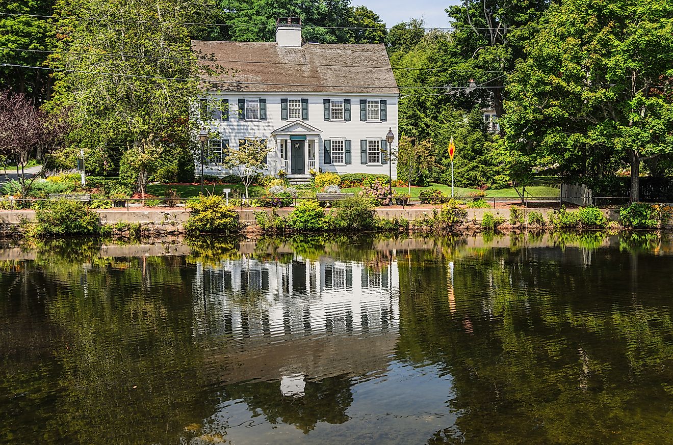 Historic New England house reflected in Shawme Lake, Sandwich, Massachusetts, USA