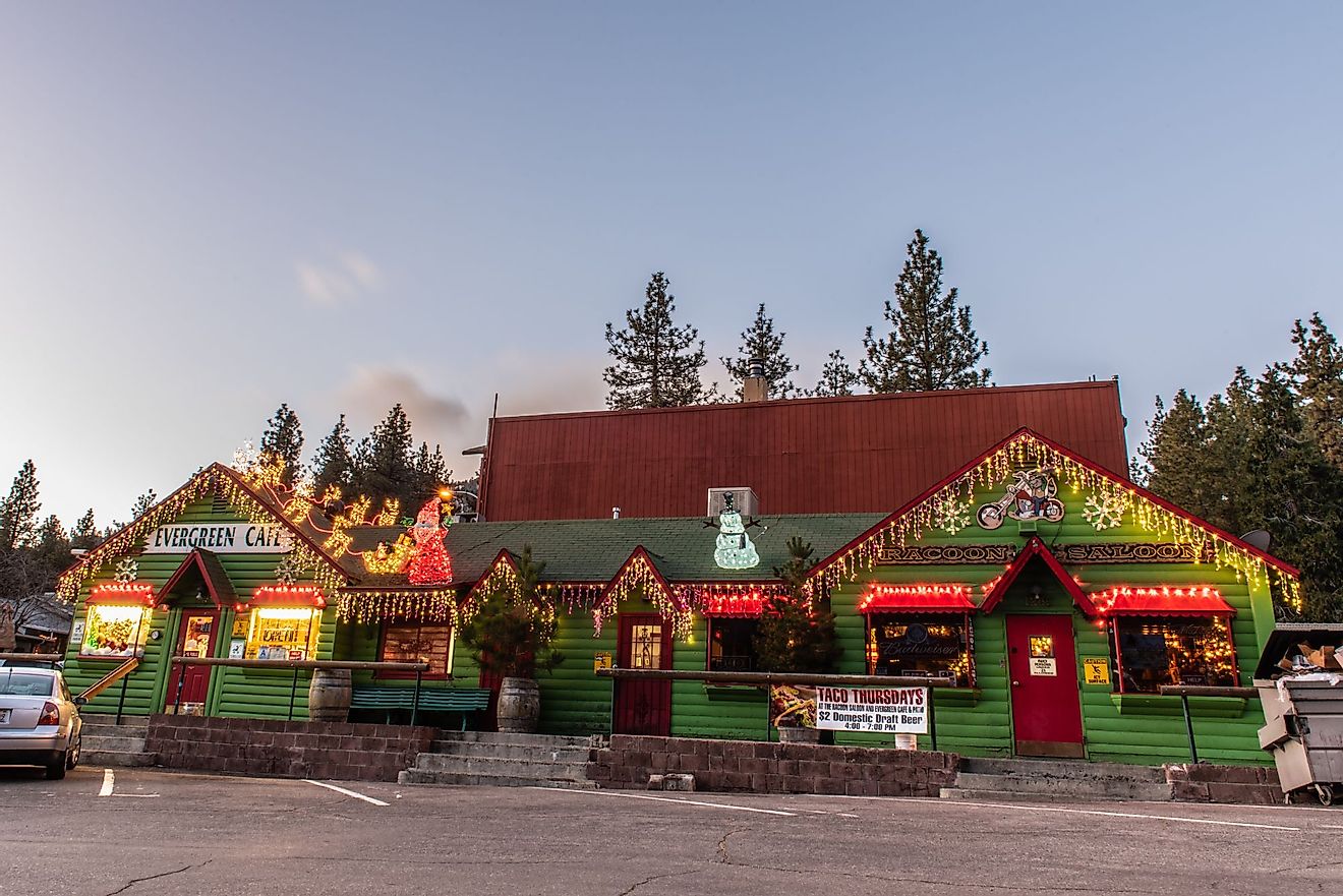 Evergreen Cafe and Racoon Saloon in Christmas holiday lights in Wrightwood, California. Image credit Jon Osumi via Shutterstock.com