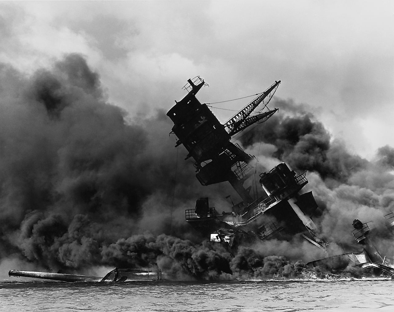 The USS Arizona (BB-39) burning after the Japanese attack on Pearl Harbor.