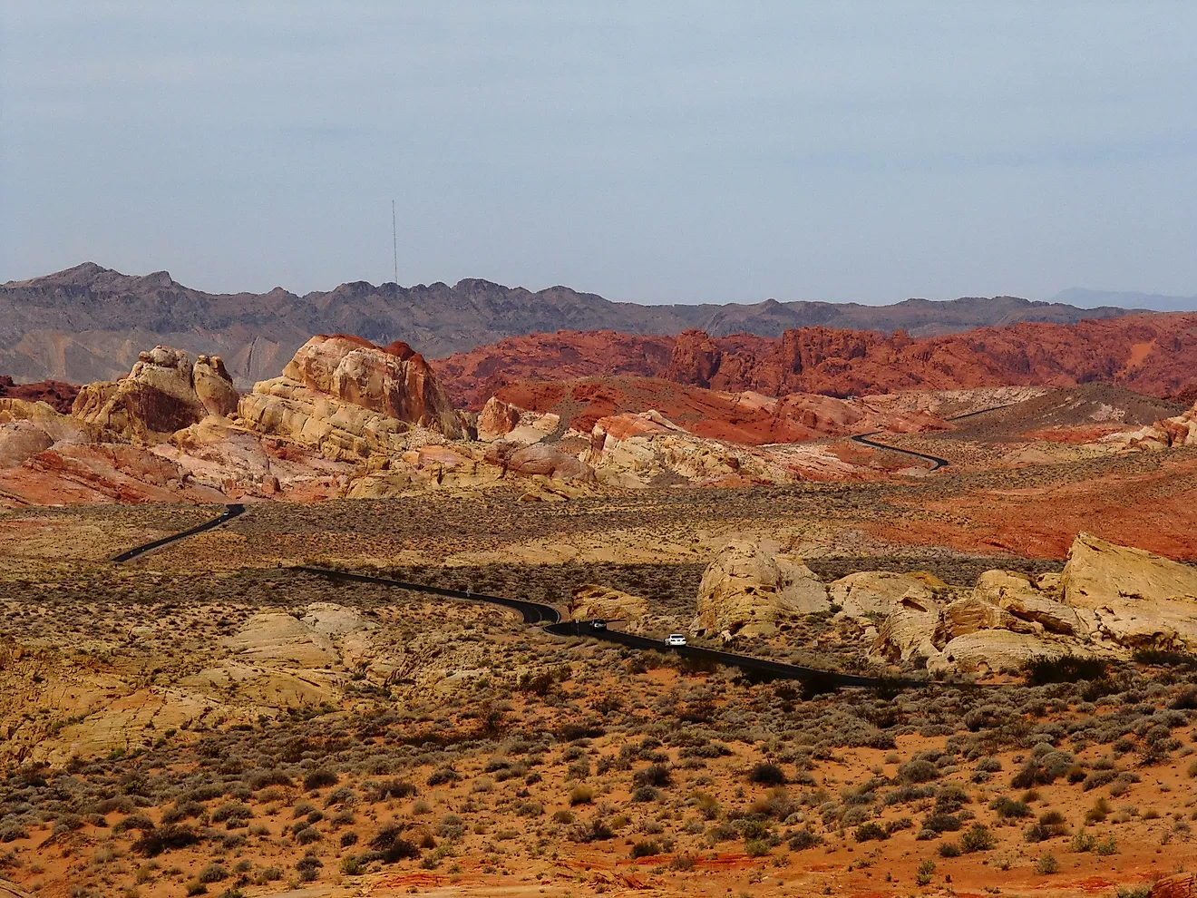 Road running through the otherworldly multicoloured, barren landscape of the Valley of Fire State Park, Nevada. 