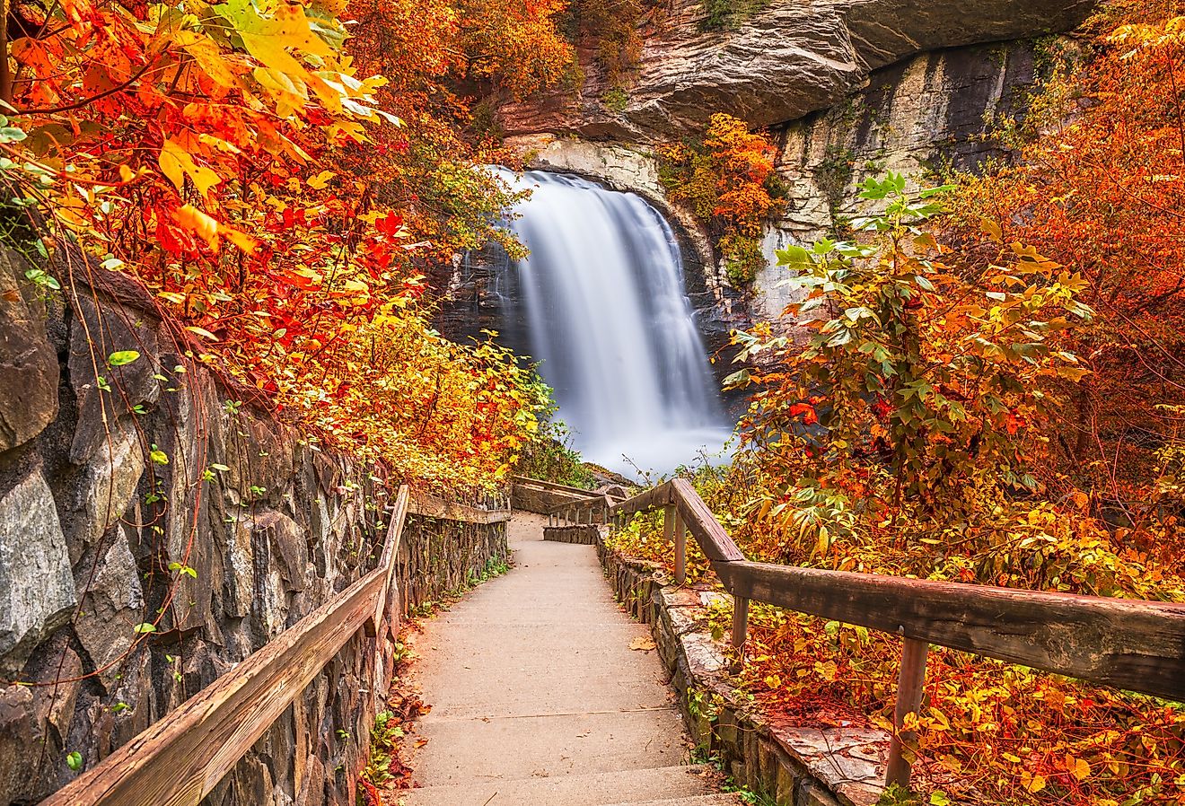 Looking Glass Falls in Pisgah National Forest, North Carolina, with early autumn foliage.