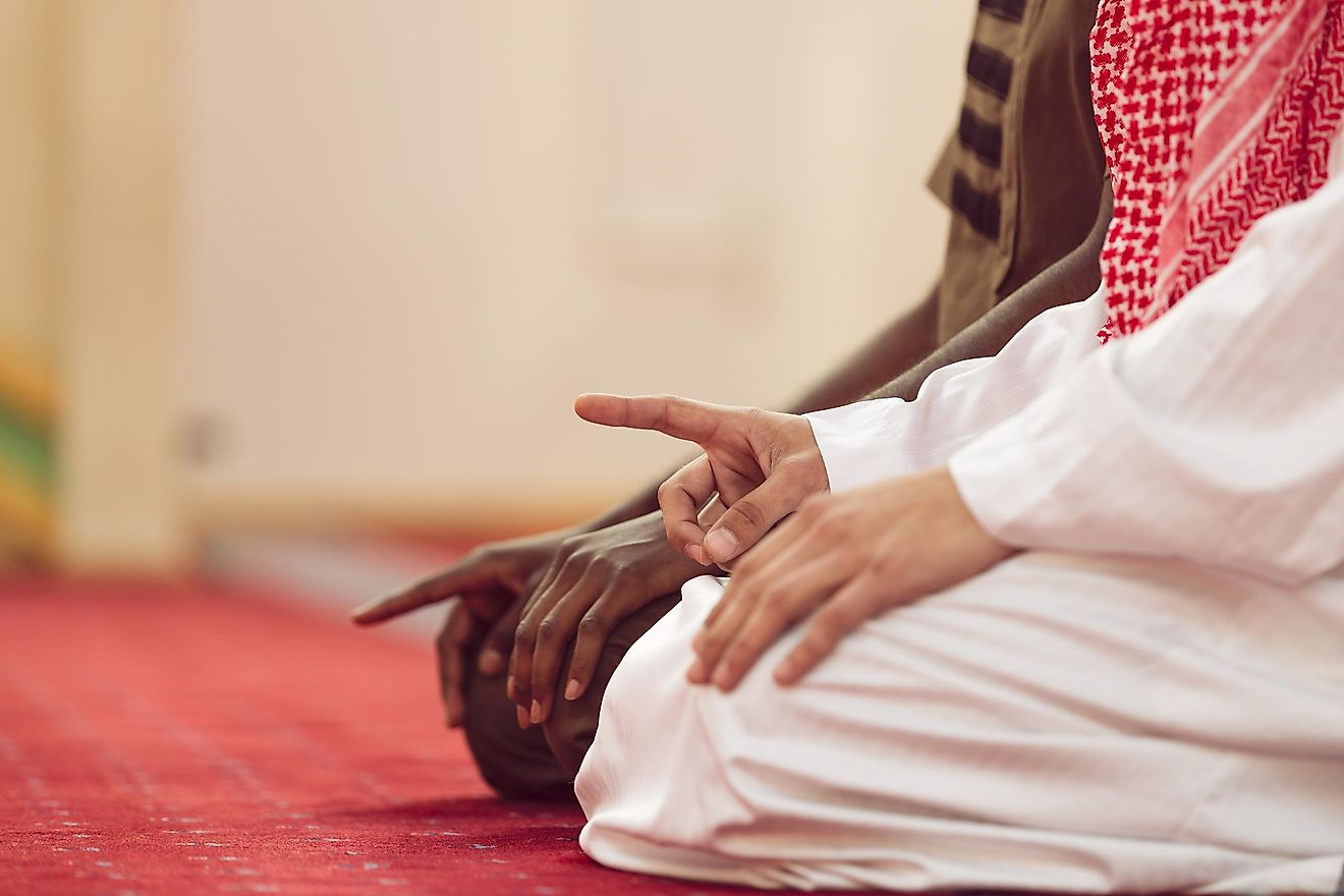 Two young Muslim men in prayer. 