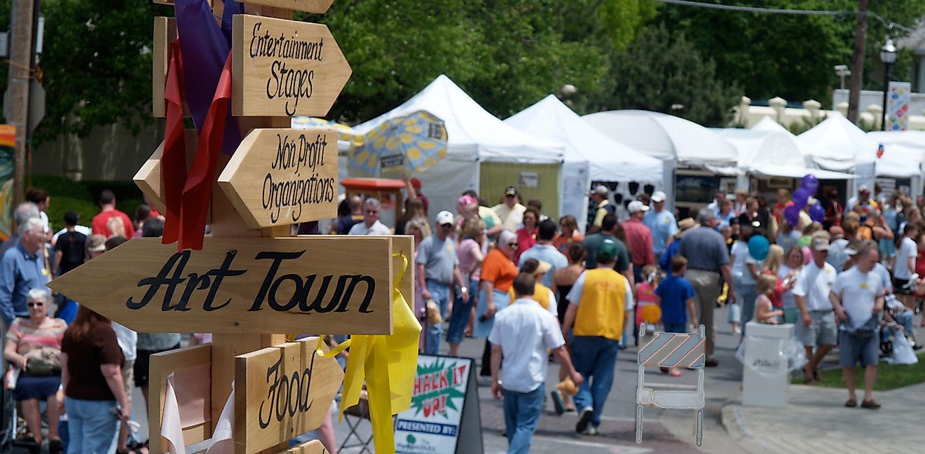 SPRINGFIELD, MISSOURI USA-MAY 7 2005 A sign points the way to "Art Town" during Arts Fest on historic Walnut Street, Springfield, MO. Artists sell their work. Editorial Credit: OzarkStockPhotography.com Via Shutterstock.