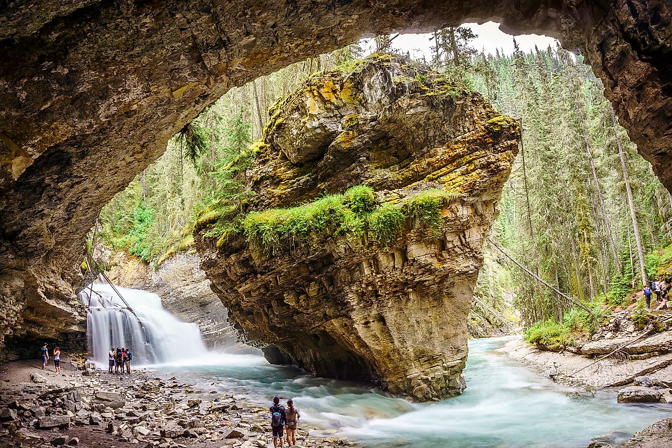 Hikers admiring the beauty of the Johnston Canyon.